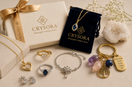 Crysora jewellery and keepsakes with gold and silver pieces, gemstone keyring and gift packaging